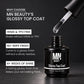 MN Beauty Glossy Top Coat nail polish bottle in black with a dropper applicator above it, shown on a dark background with promotional text about HEMA and TPO free finish and up to 4 weeks of shine.